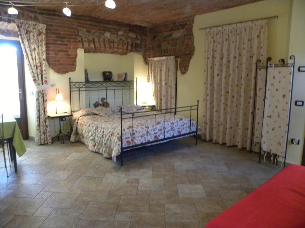 Agriturismo Fano'S Farm Suno Room photo