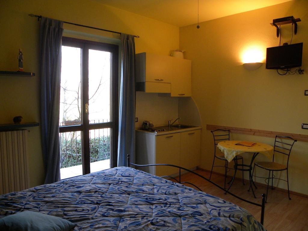 Agriturismo Fano'S Farm Suno Room photo