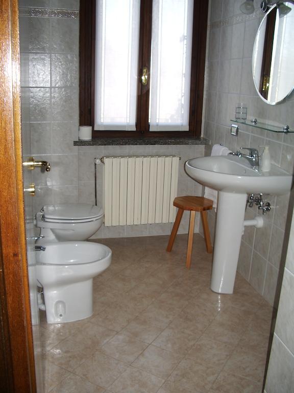 Agriturismo Fano'S Farm Suno Room photo