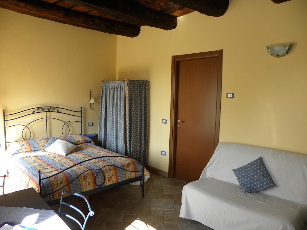 Agriturismo Fano'S Farm Suno Room photo