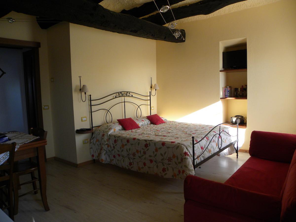 Agriturismo Fano'S Farm Suno Room photo